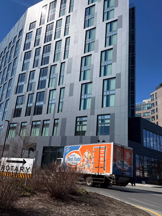 BBRM truck at a modern commercial high-rise building in Boston